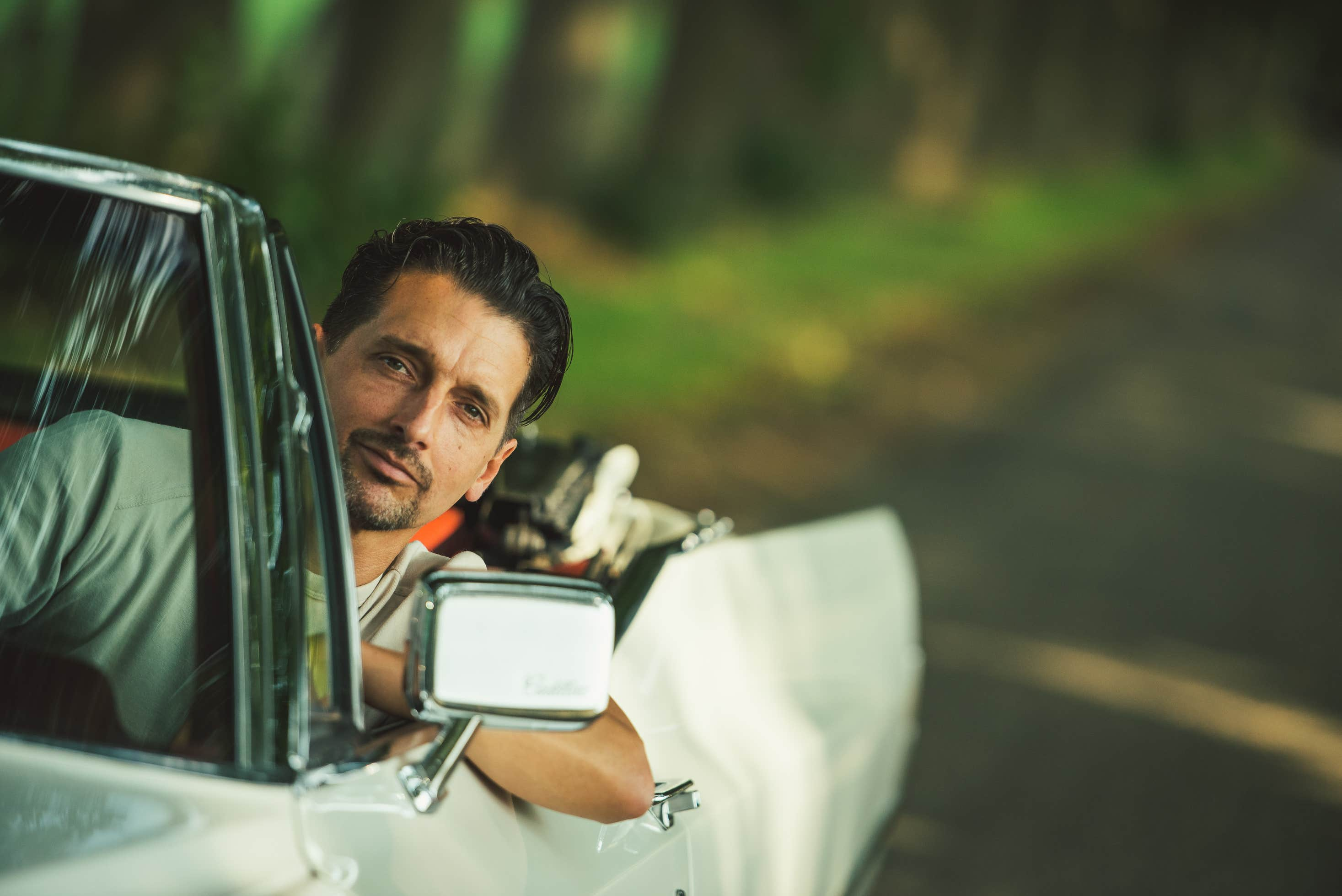 Pat in the 1968 Cadillac love driving in the Netherlands